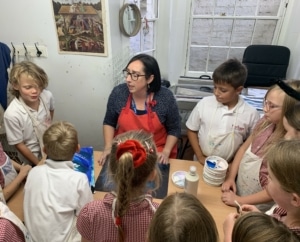 Heritage Year 4 pupils paint water and waves.