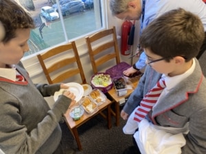 Year 5 pupils enjoy a Roman Saturnalia banquet during their Latin lessons