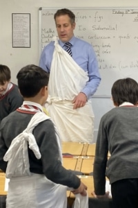 Year 5 pupils enjoy a Roman Saturnalia banquet during their Latin lessons