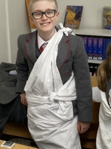 Year 5 pupils enjoy a Roman Saturnalia banquet during their Latin lessons