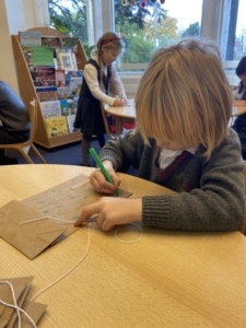 Upper Prep pupils making colourful kites in the classroom