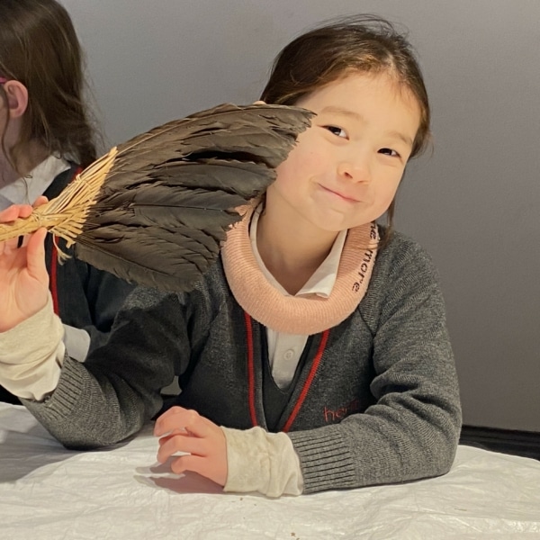 Upper Prep pupils examining artefacts and engaging in enquiry-based learning during a visit to the Museum of Archaeology and Anthropology.