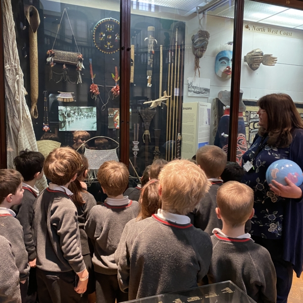 Upper Prep pupils examining artefacts and engaging in enquiry-based learning during a visit to the Museum of Archaeology and Anthropology.