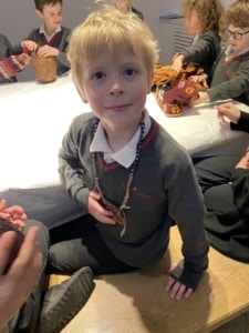 Upper Prep pupils examining artefacts and engaging in enquiry-based learning during a visit to the Museum of Archaeology and Anthropology.