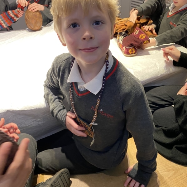 Upper Prep pupils examining artefacts and engaging in enquiry-based learning during a visit to the Museum of Archaeology and Anthropology.