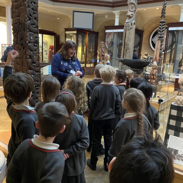 Upper Prep pupils examining artefacts and engaging in enquiry-based learning during a visit to the Museum of Archaeology and Anthropology.