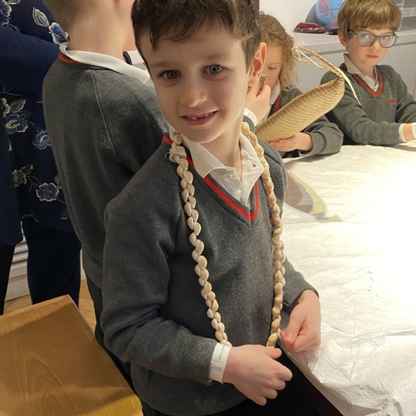 Upper Prep pupils examining artefacts and engaging in enquiry-based learning during a visit to the Museum of Archaeology and Anthropology.