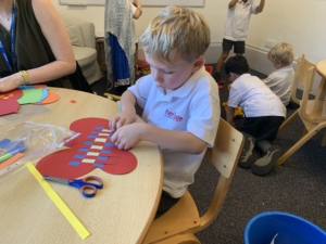 Heritage Upper Prep pupils do a paper weaving craft.