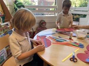 Heritage Upper Prep pupils do a paper weaving craft.