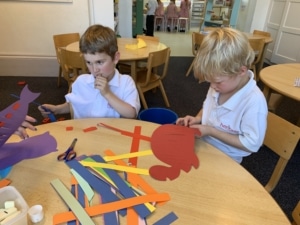 Heritage Upper Prep pupils do a paper weaving craft.