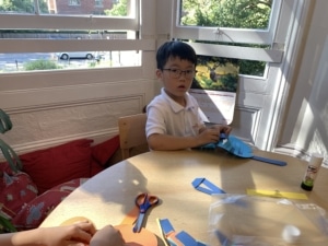 Heritage Upper Prep pupils do a paper weaving craft.
