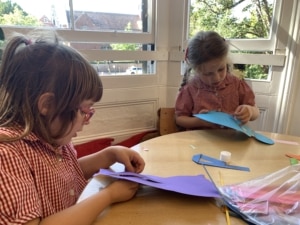 Heritage Upper Prep pupils do a paper weaving craft.