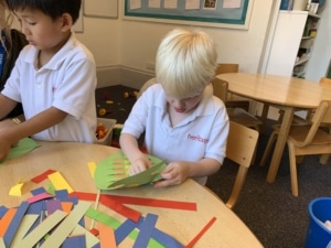 Heritage Upper Prep pupils do a paper weaving craft.