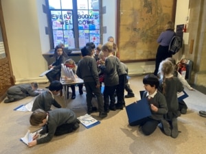 Upper Prep pupils exploring fossils and geological specimens at the Sedgwick Museum of Earth Sciences.