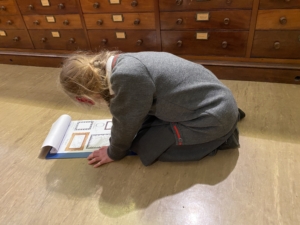 Upper Prep pupils exploring fossils and geological specimens at the Sedgwick Museum of Earth Sciences.