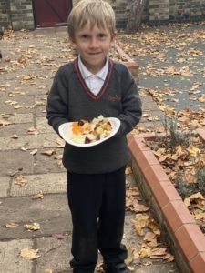 Year 2 pupils enjoying the fruit salad they made