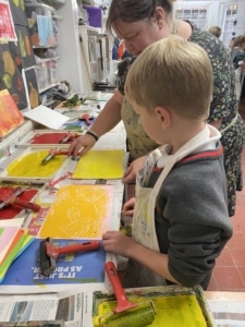 Year 2 pupils work with paint in this enrichment session