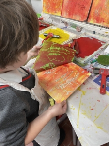 Year 2 pupils work with paint in this enrichment session