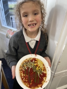 Heritage Year 2 pupils make pizzas during an enrichment session
