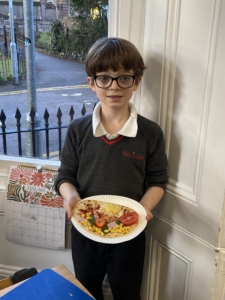 Heritage Year 2 pupils make pizzas during an enrichment session