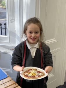 Heritage Year 2 pupils make pizzas during an enrichment session