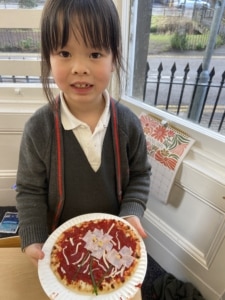 Heritage Year 2 pupils make pizzas during an enrichment session