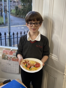 Heritage Year 2 pupils make pizzas during an enrichment session