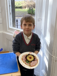 Heritage Year 2 pupils make pizzas during an enrichment session