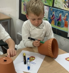 Heritage Y2 pupils decorating plant pots