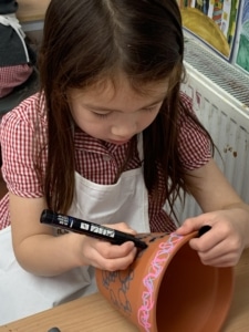 Heritage Y2 pupils decorating plant pots