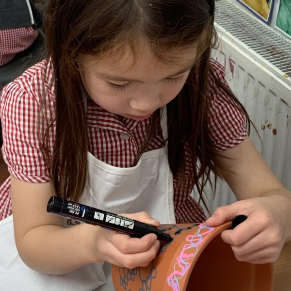 Heritage Y2 pupils decorating plant pots