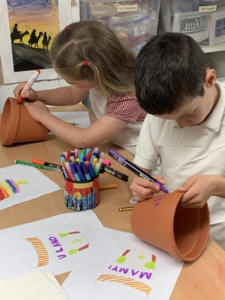 Heritage Y2 pupils decorating plant pots