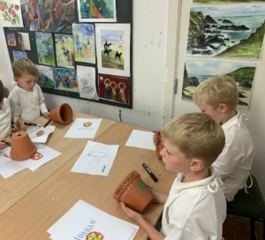 Heritage Y2 pupils decorating plant pots