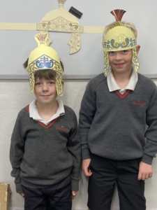 Heritage Year 2 pupils made and tried on their own Roman helmets
