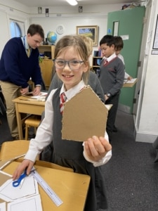 Heritage Year 5 pupils building cardboard windmills during a STEM enrichment activity.