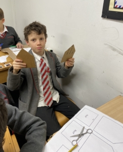 Heritage Year 5 pupils building cardboard windmills during a STEM enrichment activity.