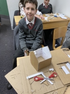 Heritage Year 5 pupils building cardboard windmills during a STEM enrichment activity.
