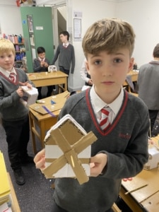 Heritage Year 5 pupils building cardboard windmills during a STEM enrichment activity.