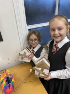 Heritage Year 5 pupils building cardboard windmills during a STEM enrichment activity.