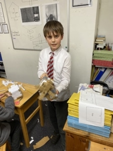 Heritage Year 5 pupils building cardboard windmills during a STEM enrichment activity.
