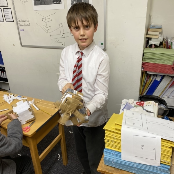 Heritage Year 5 pupils building cardboard windmills during a STEM enrichment activity.