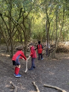 Heritage Year 6 pupils building dens at Anglesey Abbey