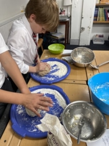 Heritage Year 6 pupils bake bread during an enrichment session