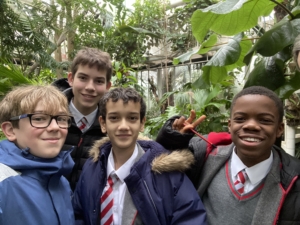 Year 8 and Year 9 pupils studying plant adaptations in the glasshouses at the Cambridge University Botanic Garden.