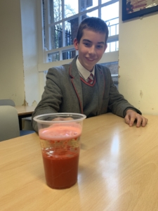 Heritage Year 9 Geography pupils carrying out a classroom volcano eruption experiment.