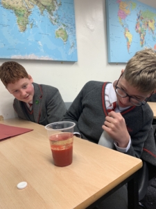 Heritage Year 9 Geography pupils carrying out a classroom volcano eruption experiment.