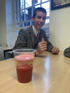 Heritage Year 9 Geography pupils carrying out a classroom volcano eruption experiment.