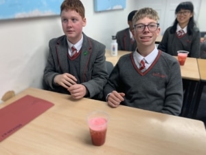 Heritage Year 9 Geography pupils carrying out a classroom volcano eruption experiment.